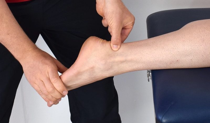 Chiropractor treating Achilles pain, Chiropractor Cheltenham