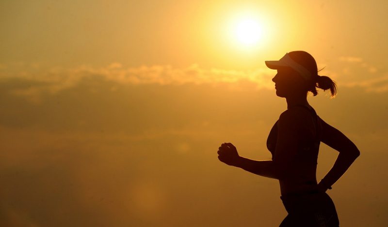 Woman running with sunset, Skelian Chiropractic Clinic