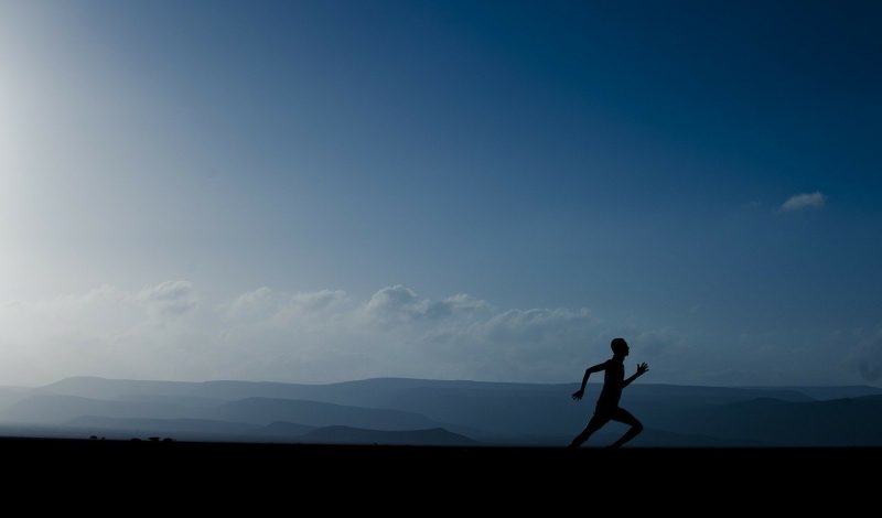 Man running on hillside, Skelian Chiropractic Clinic