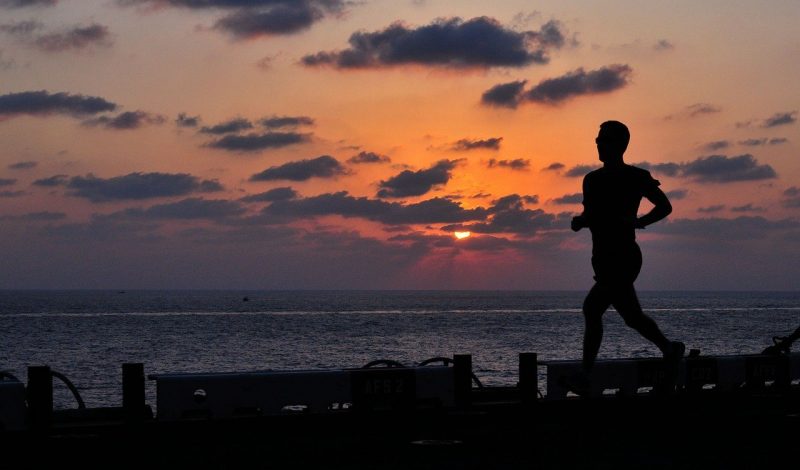 Man running on seafront, Skelian Chiropractic Clinic