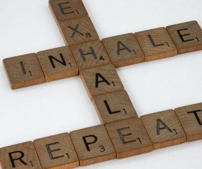 wooden scrabble that reads inhale, exhale, repeat