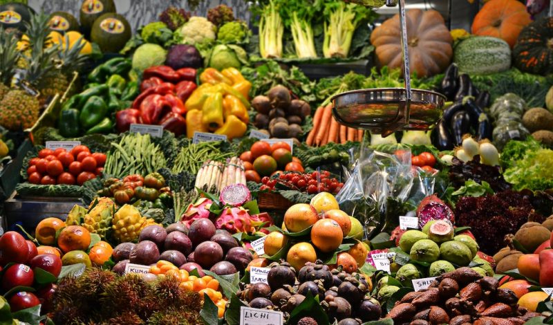 Market stall showing a wide variety of fruit and vegetables